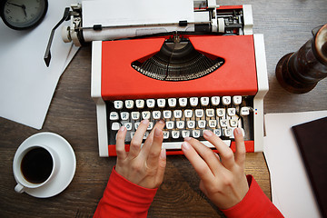 Image showing Vintage red typewriter with blank paper