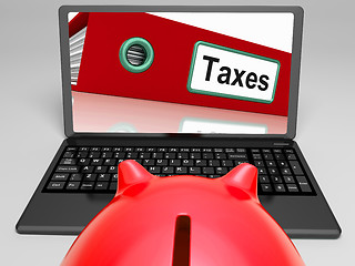 Image showing Taxes Laptop Means Paying Due Tax Online