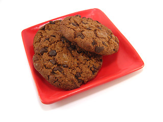 Image showing chocolate cookies on a red plate