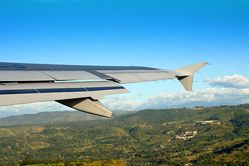 Image showing Take-off over Asian city