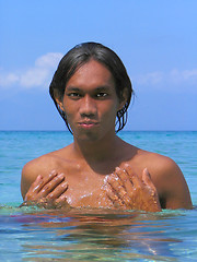 Image showing Asian boy portrait in tropical sea.