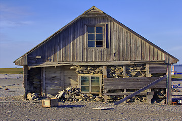 Image showing Three-layered house of old polar station on shore of Barents sea. Cape White Nose, Yugorsky Peninsula, Destroyed by hurricane and powerful storm