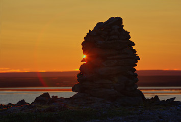 Image showing Built from stone Cairn at sunset, at midnight, the polar day