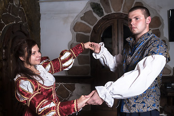 Image showing Attractive couple in retro dresses dance