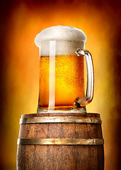 Image showing Beer with cask on yellow