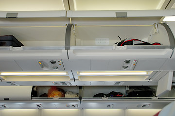 Image showing Luggage bins on airplane