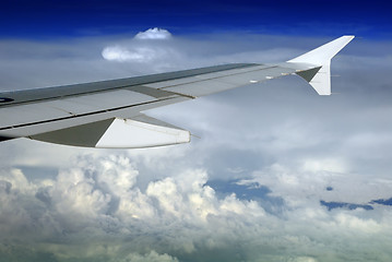 Image showing Airplane wing over cloudscape