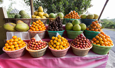 Image showing tropical fruits in baskets on fruit market