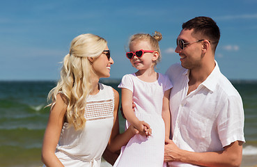 Image showing happy family in sunglasses on summer beach