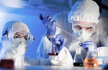 Image showing close up of scientists making test in lab