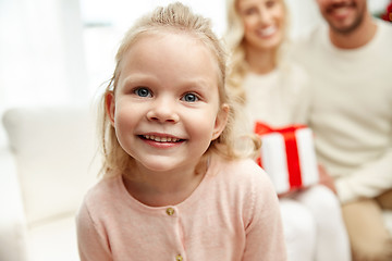 Image showing happy family at home with christmas gift box