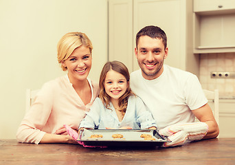 Image showing happy family making cookies at home