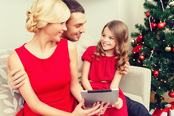 Image showing smiling family with tablet pc