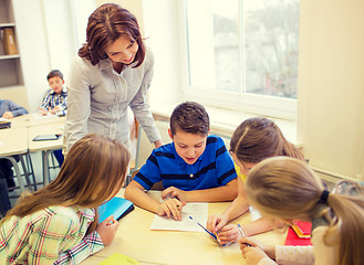 Image showing group of school kids writing test in classroom