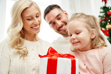 Image showing happy family at home with christmas gift box