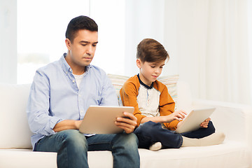 Image showing father and son with tablet pc at home