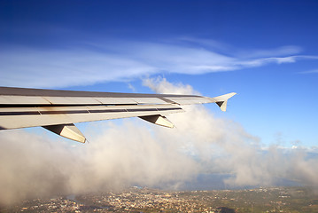 Image showing Take-off over Asian city