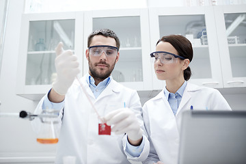 Image showing young scientists making test or research in lab