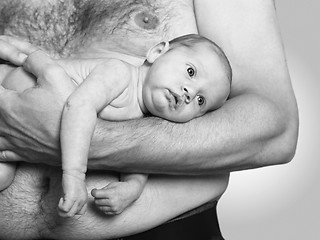 Image showing Father holding baby