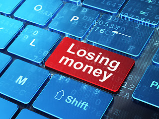 Image showing Banking concept: Losing Money on computer keyboard background