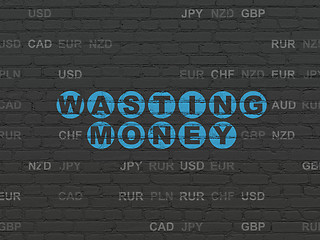 Image showing Money concept: Wasting Money on wall background