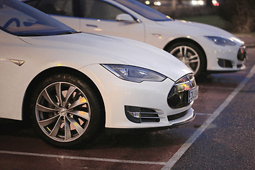 Image showing Two White Tesla Model S Cars at Night