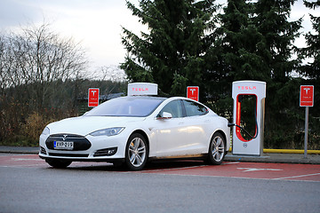 Image showing White Tesla Model S being Charged at Supercharger Station