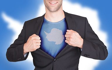 Image showing Businessman opening suit to reveal shirt with flag