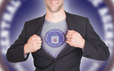 Image showing Businessman opening suit to reveal shirt with flag