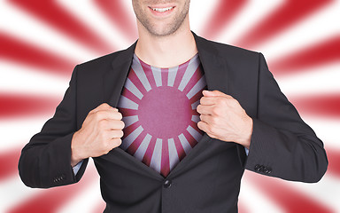 Image showing Businessman opening suit to reveal shirt with flag