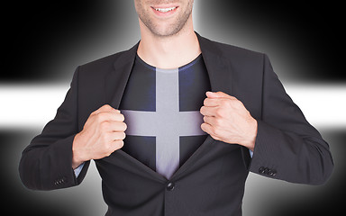 Image showing Businessman opening suit to reveal shirt with flag