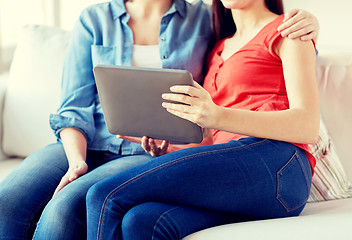 Image showing close up of lesbian couple with tablet pc at home