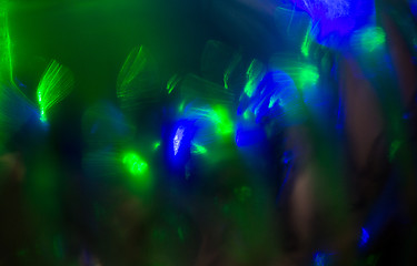 Image showing blue green night lights bokeh over dark background