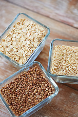 Image showing close up of grain in glass bowls on wooden table