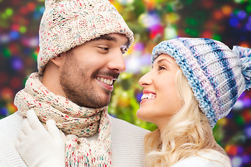 Image showing smiling couple in winter clothes hugging