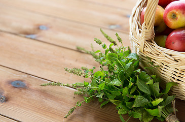 Image showing close up of melissa and basket with apples