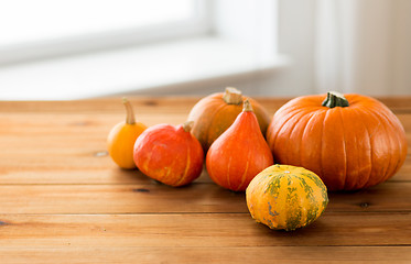 Image showing close up of pumpkins on wooden table at home