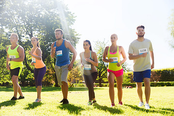 Image showing sportsmen with badge numbers on start of race