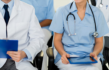 Image showing close up of happy doctors at seminar or hospital