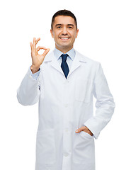 Image showing smiling doctor in white coat showing ok hand sign