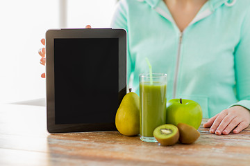 Image showing close up of woman hands tablet pc and fruit juice