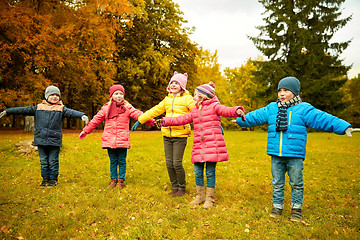 Image showing happy little children running and playing outdoors