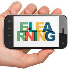 Image showing Learning concept: Hand Holding Smartphone with E-learning on  display