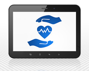 Image showing Insurance concept: Tablet Pc Computer with Heart And Palm on display