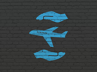 Image showing Insurance concept: Airplane And Palm on wall background