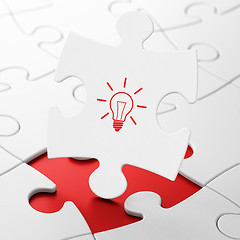 Image showing Business concept: Light Bulb on puzzle background