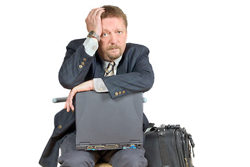 Image showing Unhappy traveling businessman.