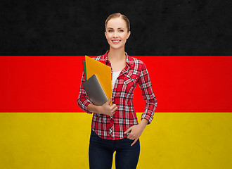 Image showing happy student girl with tablet pc and folders