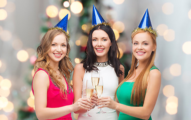 Image showing smiling women holding glasses of sparkling wine