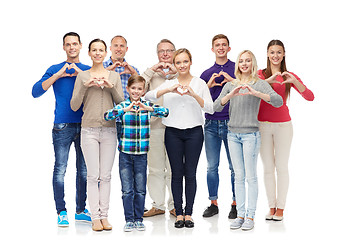 Image showing group of smiling people showing heart hand sign